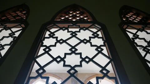 Arabic mosque window interior with silhouette Stock Photos
