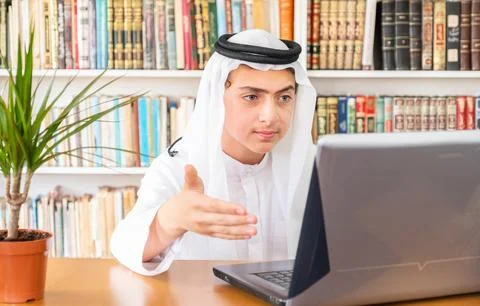 Arabic muslim man explaining something online Stock Photos