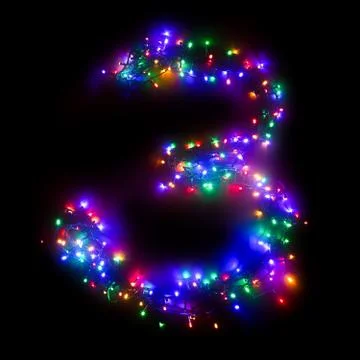 Arabic numeral "3" from a multi-colored electric garland on a black isolated  Stock Photos