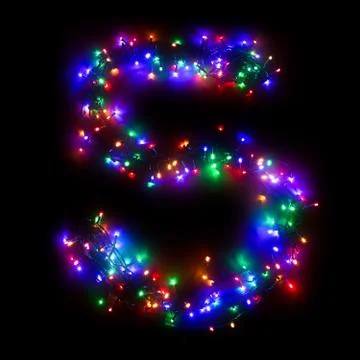 Arabic numeral "5" from a multi-colored electric garland on a black isolated  Stock Photos