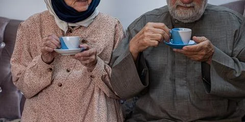 Arabic old couples drinking coffee together Stock Photos