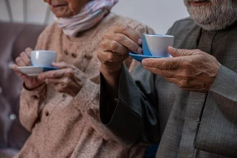 Arabic old couples drinking coffee together Stock Photos