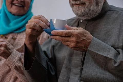 Arabic old couples drinking coffee together Stock Photos