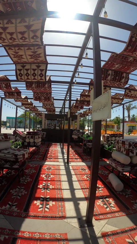 Arabic Outdoor Seating Under a Sunlit Pergola Stock Footage 344121433
