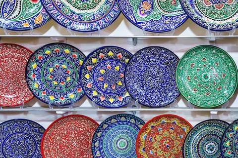 Arabic painted ceramic plates on the wall. Stock Photos