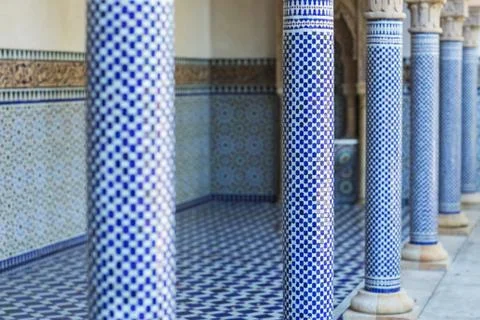 Arabic pattern on a tiled wall of a Muslim building, abstract background and Stock Photos