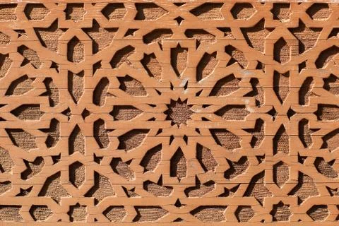 Arabic pattern on a tiled wall of a Muslim building, abstract background and Stock Photos