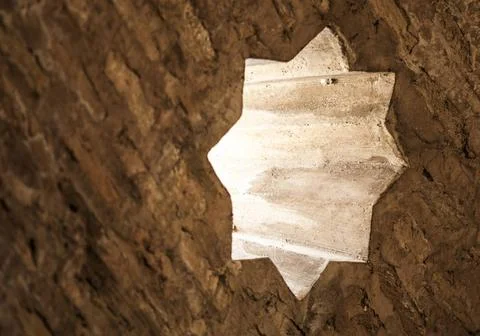 Arabic pattern wall Arabic pattern old wall. Small windows. Natural light ... Stock Photos