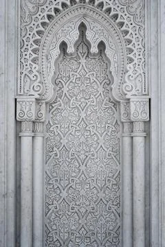 Arabic Patterns carved on a marble wall in Morocco Foto stock