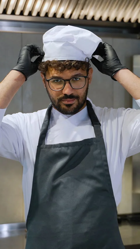 Arabic Shawarma Chef Adjusting Hat in Commercial Kitchen Video stock 311484860