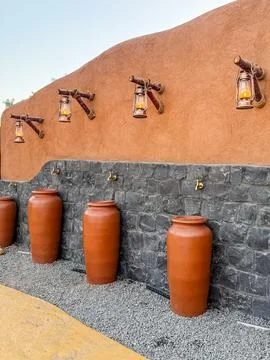 Arabic Style Earthenware Pots with Decorative Lanterns in Heritage Setting Stock Photos
