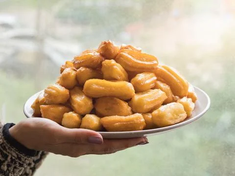Arabic sweets Tulumba, celebration Eid Ramadan. Tulumba- arabian syrup-soaked Stock Photos
