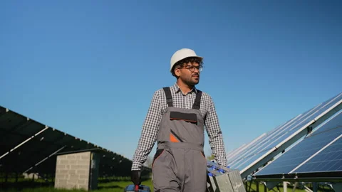 Arabic technician walking in solar panel farm Video stock 314403895