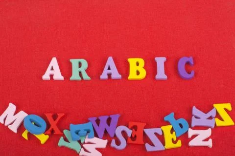 ARABIC word on red background composed from colorful abc alphabet block woode Stock Photos