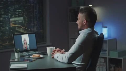 Arabic young man having video call with beautiful blonde woman in office in the Video stock 157600921