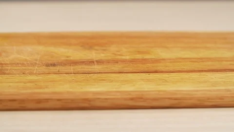 Arabica roasted coffee grains fall slow motion along a wooden table closeup Stock Footage 113074463