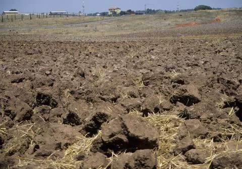 Arable field after plowing Stock Photos