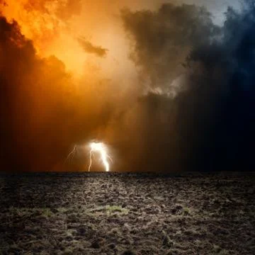 Arable field, dark sky Illustrazione stock