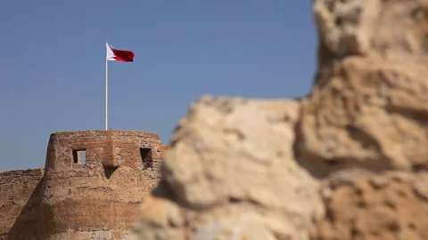 Arad Fort. Ancient wall and Flag. Camera Movement. Bahrain Stock Footage
