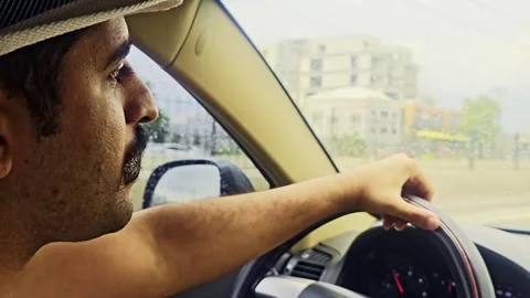 Araffe driving a car in the rain. Stock-Footage 284669500