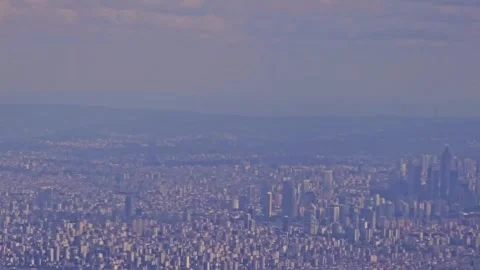 Araffe flying over a city with a. Stock Footage 284099442