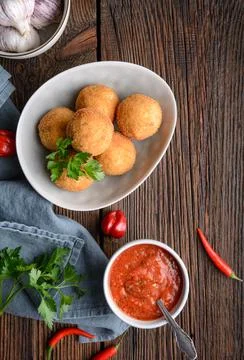 Arancini Di Riso, crispy Sicilian rice balls stuffed with Mozzarella cheese Stock Photos