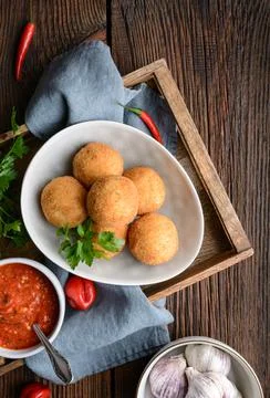 Arancini Di Riso, crispy Sicilian rice balls stuffed with Mozzarella cheese Stock Photos