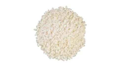 Arborio risotto short grain rice heap isolated on white background. nutrition Foto stock