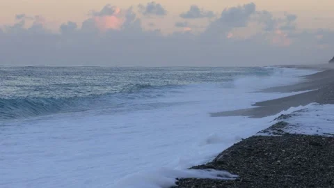In arc beach at sunset,the continuous rolling wave, picturesque seascape. Stock Footage 277963791