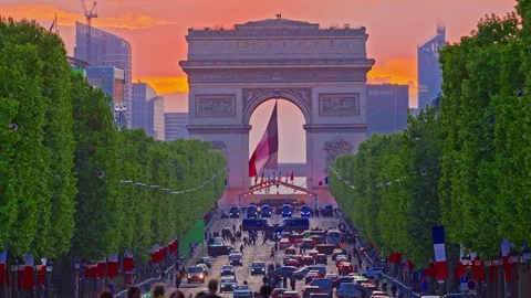 Arc de Triomphe against the backdrop of a beautiful sunset. Champs Elysees with Stock Footage 314657152