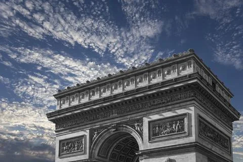 Arc de Triomphe (against the background of sky with clouds), Paris, France Stock Photos