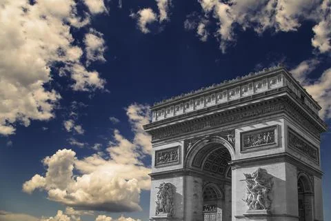 Arc de Triomphe (against the background of sky with clouds), Paris, France Stock Photos