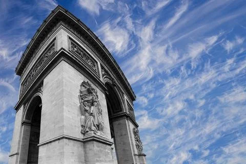 Arc de Triomphe (against the background of sky with clouds), Paris, France Stock Photos