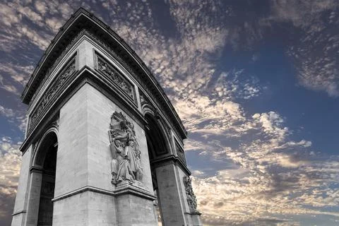 Arc de Triomphe (against the background of sky with clouds), Paris, France Stock Photos