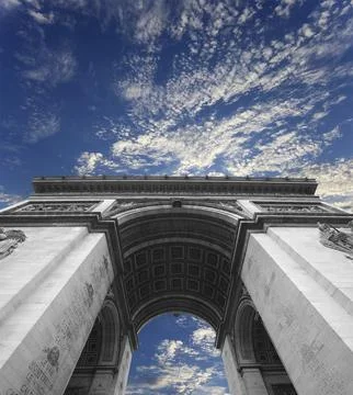 Arc de Triomphe (against the background of sky with clouds), Paris, France Stock Photos