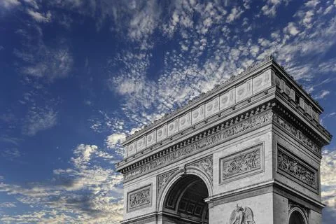 Arc de Triomphe (against the background of sky with clouds), Paris, France Stock Photos