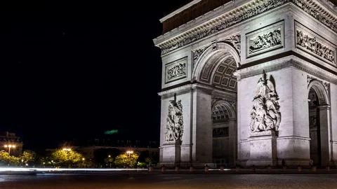 Arc de Triomphe (Arch of Triumph) at night. Car traffic, light trails. Zoom in. Stock Footage 87758447