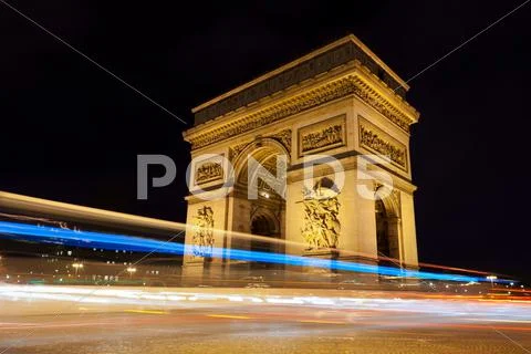Arc de triomphe - arch of triumph by night in paris, france Stock Photos
