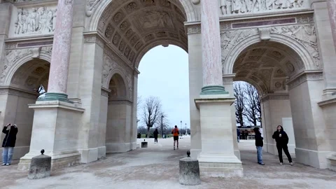 The Arc de Triomphe du Carrousel is seen in Paris on an overcast morning People Stock Footage 330923109