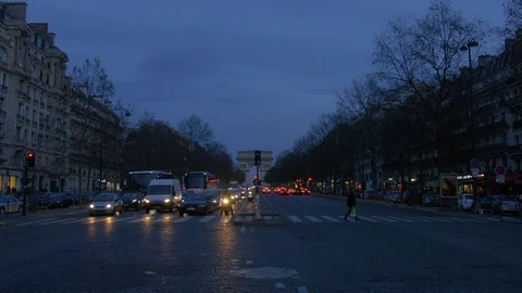 Arc de Triomphe at the end of road at night, car traffic in Paris France  Stock Footage 85677914