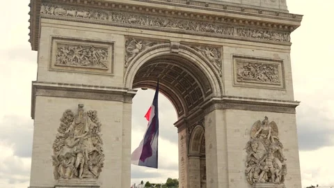 Arc de Triomphe with French flag blowing in the wind in Paris, France 06.08.2025 Stock Footage 311060281