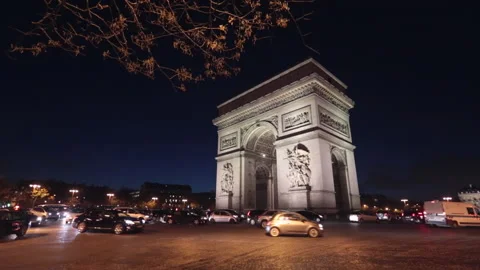 Arc de triomphe illuminated at night with time lapse traffic Stock Footage 134682073