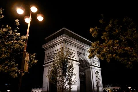 Arc de Triomphe illuminated at night Paris France Stock Photos