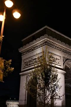 Arc de Triomphe illuminated at night Paris France Stock Photos