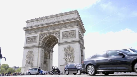 Arc de Triomphe low angle traffic circle cars motorcycles scooters Paris France Stock-Footage 93810972