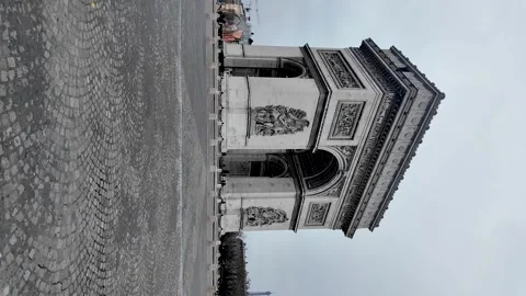 Arc de Triomphe marking the center of a busy traffic circle in Paris. vertical Stock Footage 330910453