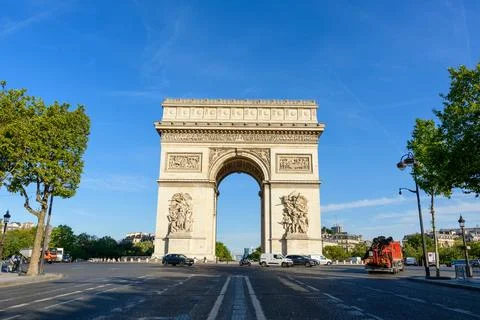 Arc de Triomphe monument and vehicles on Place Charles de Gaulle in Paris 写真素材