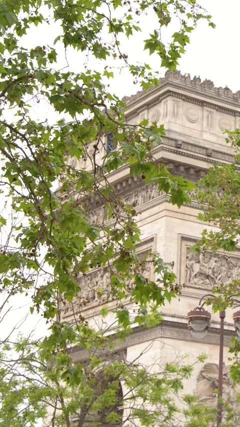 Arc de Triomphe Monument Framed by Green Tree Leaves in Paris Stock-Footage 342236179