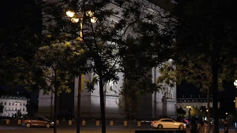 Arc de Triomphe at night with pedestrians and cyclist Paris, France 06.07.2025 Stock Footage 310953682