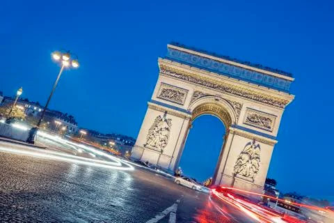 Arc de triomphe at night. Stock Photos